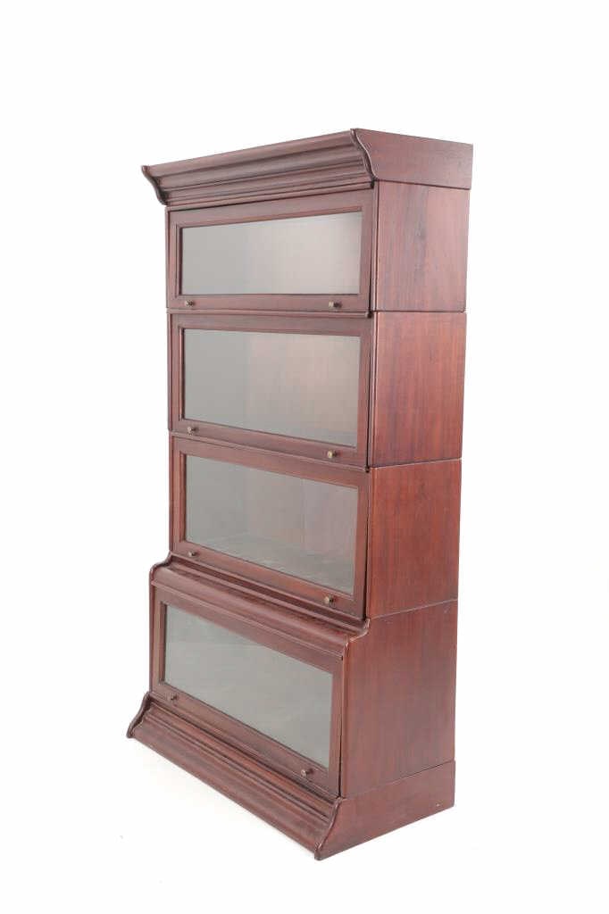 Mahogany Barrister Four Piece Cabinet Mid 1900s: Featured in this lot is this beautiful, mahogany barrister bookcase with four cabinets (six sectionals) circa mid 1900s. No makers mark is present. The barrister bookcase was born out of necessity. Ba