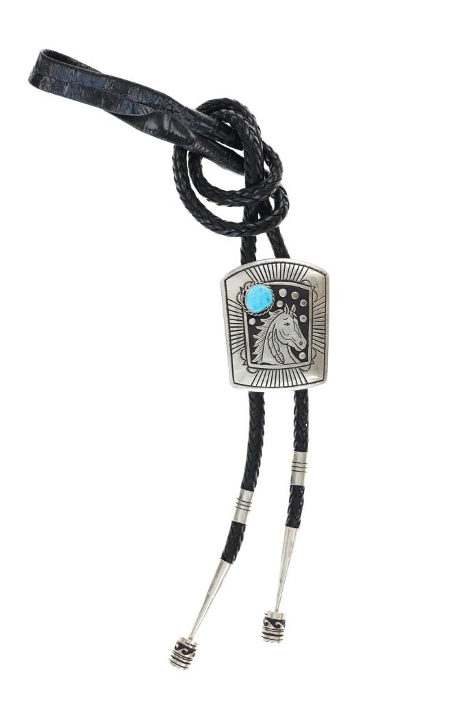 Navajo Tommy & Rose Singer Large Horse Bolo Tie: This is a large Navajo Tommy & Rose Singer horse bolo tie with barrel bead tips. Tommy Singer was a renowned Navajo Silversmith. He grew up on the Navajo Reservation and was taught silversmithing by h