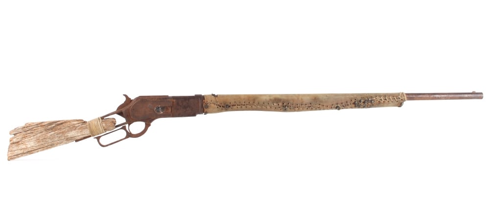 Winchester Model 1876 .50 Indian Owned Rifle: An extremely rare Winchester Model 1876 Native American Indian Owned "burial gun" rifle chambered in .50 caliber. Winchester Model 1876, rare .50 caliber rifle with original 30? length barrel. The Mod