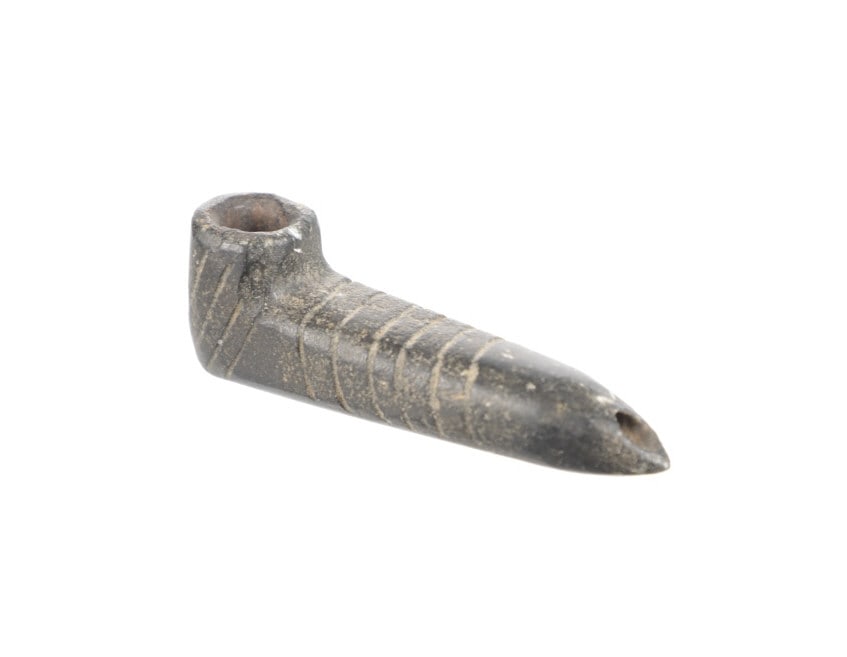 4 1/8"Mound Builder Hopewell Culture Steatite Pipe: Featured in this lot is 4 1/8" Mound Builder Hopewell Culture steatite pipe. The pipe features a wonderfully and professionally crafted steatite construciton that shows carved stripes throughout the s