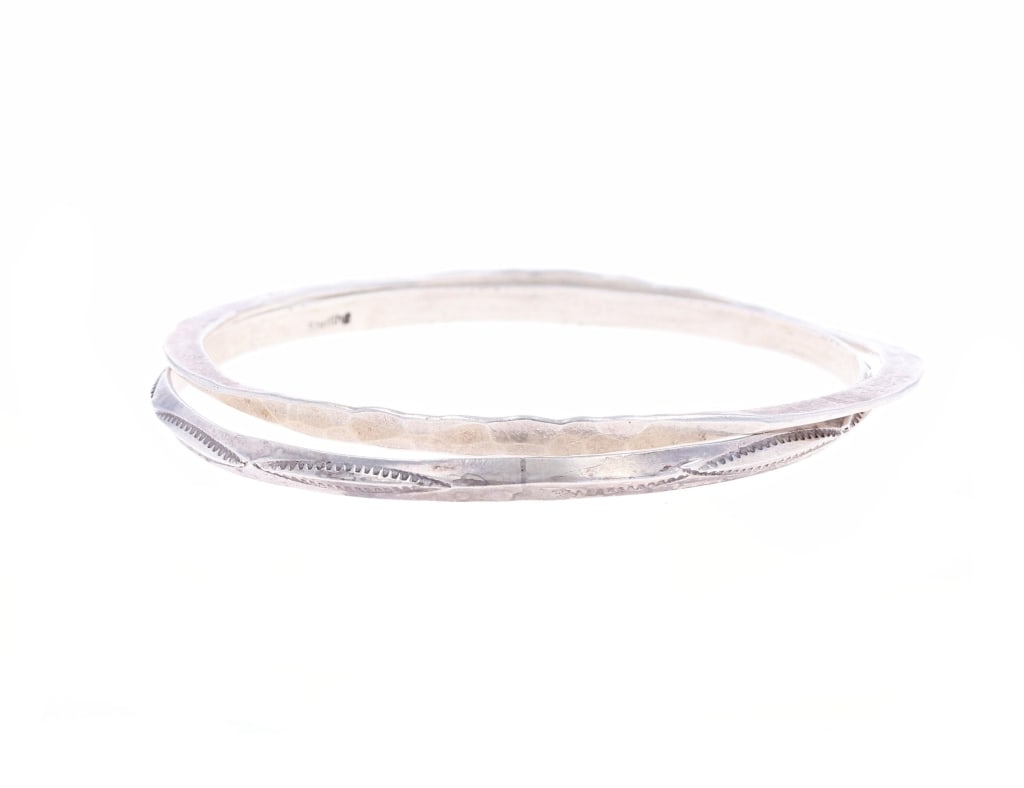 Southwestern and Mexico Silver Bangle Bracelets: Featured in this lot is this collection of Southwestern and Mexico silver bangle bracelets. The bracelets feature wonderfully and professionally handcrafted silver construction. The first bangle brace