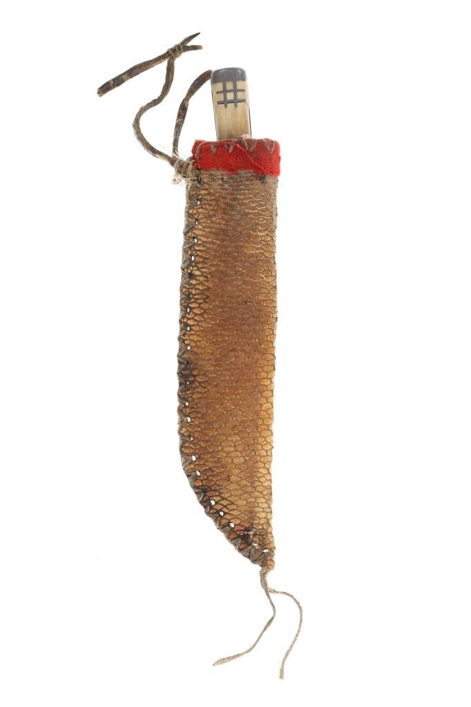 Northern Plains Beaver Tail Sheath & Trade Knife: The knife sheath is comprised of beaver tail hide over parfleche rawhide in the Northern Plains pattern paired with an old pewter inlaid knife. The sheath shows the beaver tail hide with wonderful sca