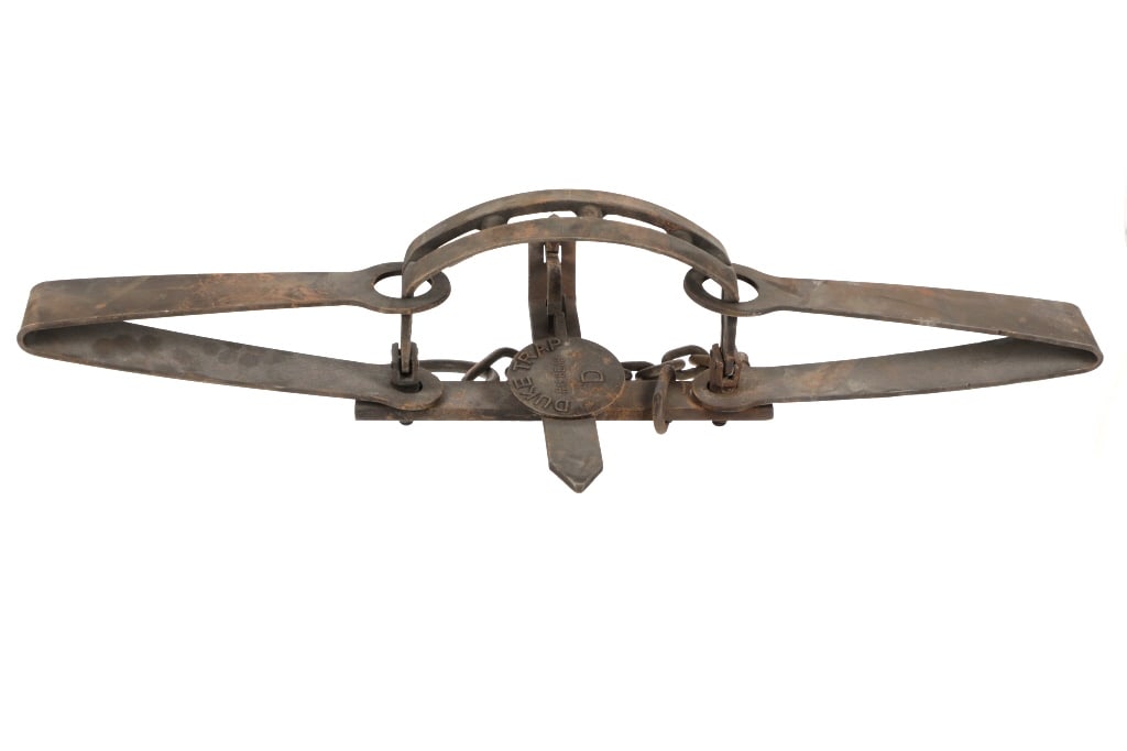Duke Trap #15 Bear D Double Spring Bear Trap: Featured in this lot is a Duke Trap No. 15, Bear D double spring bear trap. The trap features a professionally crafted steel construction that shows six staggered teeth adorning the trap and reads as