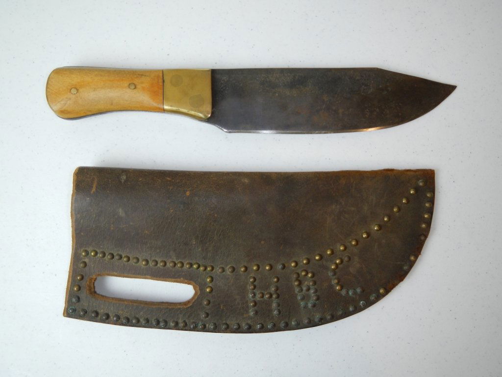 Hudson Bay Company Sheath and Knife: Sheath is made of leather and has brass tacks saying, "HBC" (which stands for Hudson Bay Company). This Trade Sheath and knife are in great shape. The knife is thick iron with some pitting on the blad