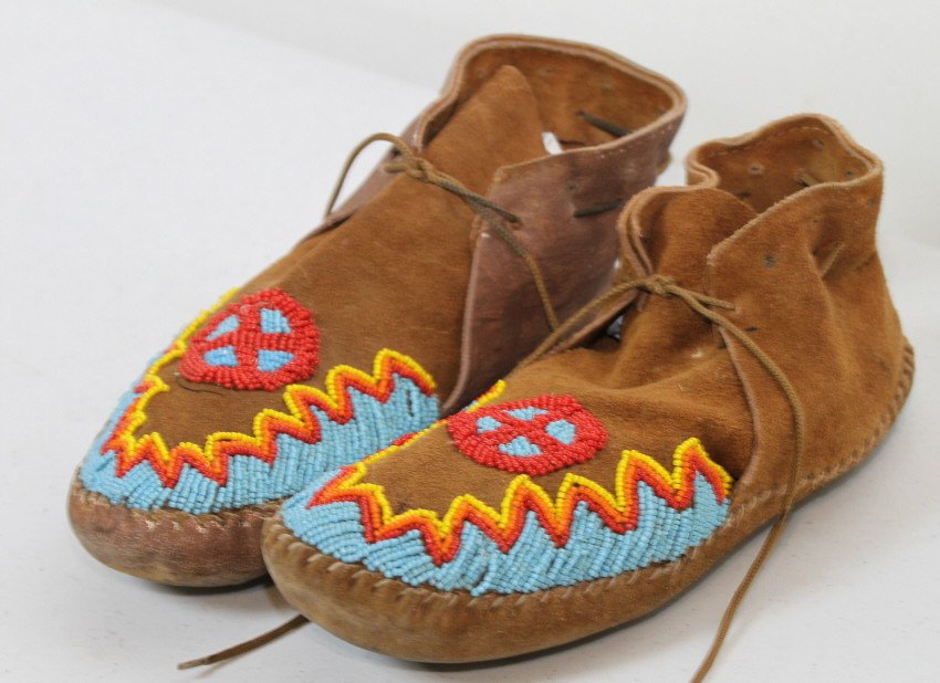 Oglala Sioux Beaded Moccasins: Tight hand woven Oglala Sioux Beadwork on leather. Oglala Sioux Tribe of the Pine Ridge Reservation are a part of the Lakota Sioux Nation.