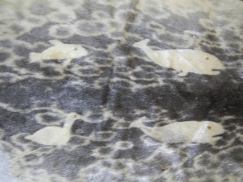 Inuit Leopard Seal Skin with Inlays: This skin is unique in the inlays of whales, narwhals, caribou, loons, and seals. Measures 34"x41"