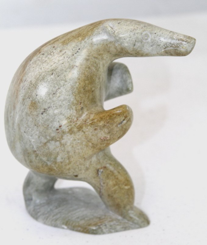 Tribal Eskimo Inuit Eyitook Sculpture: This is hand carved and signed by artist "1982 EYITOOK 8188" Sculpture is of a hunter possibly a bear standing 6" tall and 5" long.