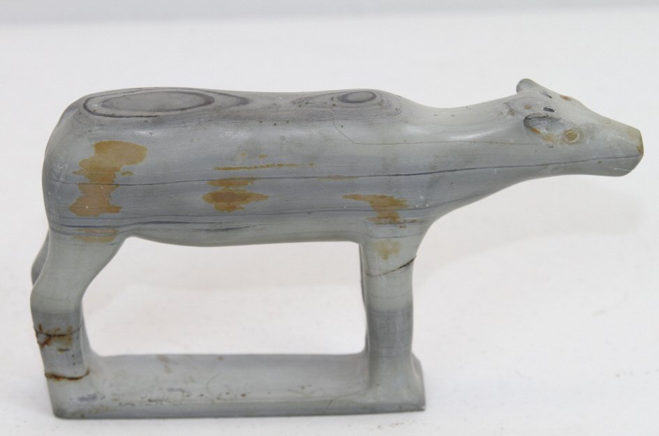 Eskimo Inuit Tribal Caribou Sculpture: This is a hand carved sculpture done by a tribe in Alaska with markings on the bottom unfamiliar to our eyes. Measures 5" tall and 9" long.