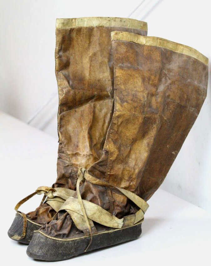 Inuit Eskimo Mukluks: These are made of Genuine Seal Skin and are antiques. These are worn by the Native Eskimo's and have a more firm sole but are incredibly light. These have the original hide straps and measure 17.5" ta