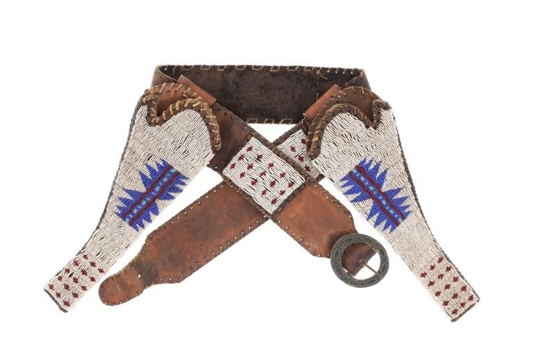 19th Century Southern Plains Beaded Colt Holsters: This is an early beaded trade leather double holster for Colt Single Action Army Revolvers from the Southern Plains Indians. The piece is comprised of commercial harness saddle trade leather with rawh