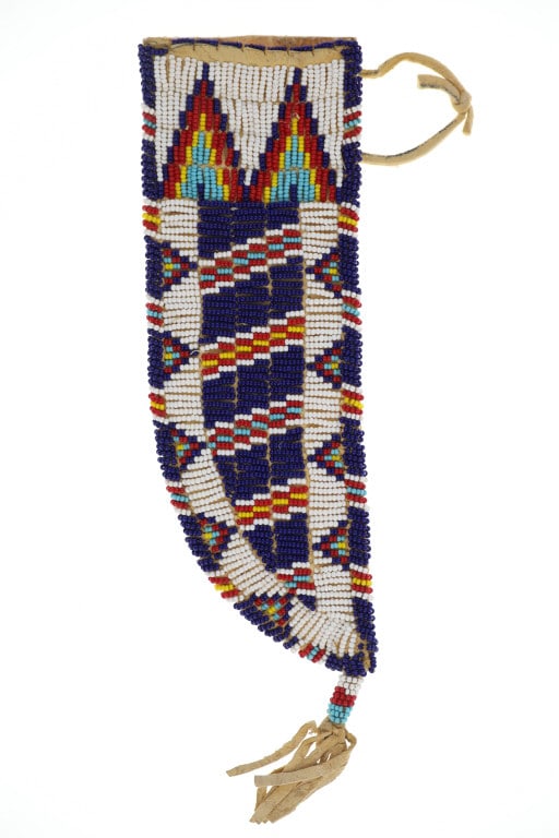 Ca. 20th C. Lakota Sioux Beaded Knife Sheath: Featured in this lot is this Lakota Sioux beaded knife sheath circa 20th century. The knife sheath features a wonderfully and professionally crafted Indian tanned hide and Parfleche hide with trade se