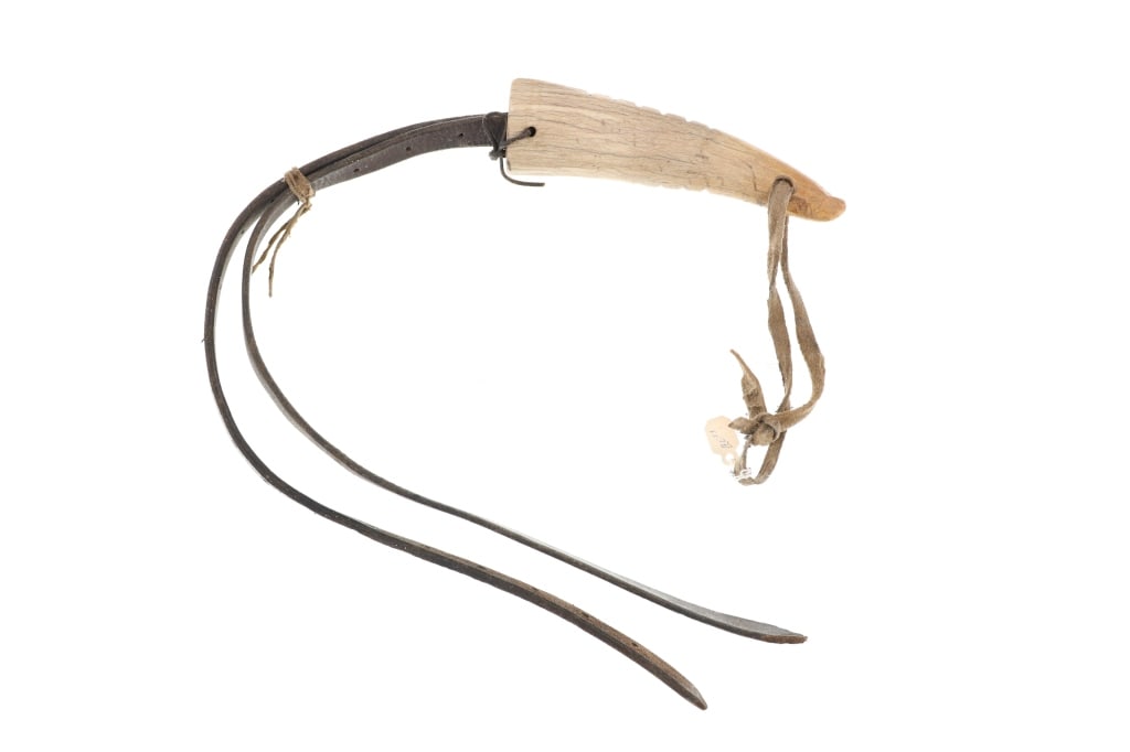 Ca. 1890 Northern Plains Carved Antler Quirt: Featured in this lot is this Northern Plains carved antler tine leather quirt circa 1890's. The quirt features a wonderfully and professionally crafted antler tine and leather construction that shows 