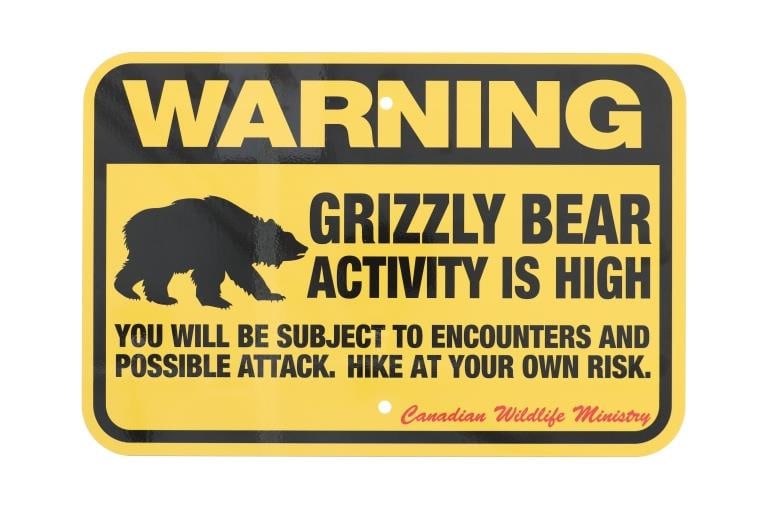 Grizzly Bear Warning Sign from Canada: This is a Grizzly Bear Warning sign from Canada. The sign is from the Canadian Wildlife Ministry and reads, "Warning Grizzly Bear Activity is High.? The sign is a high visibility yellow and features a