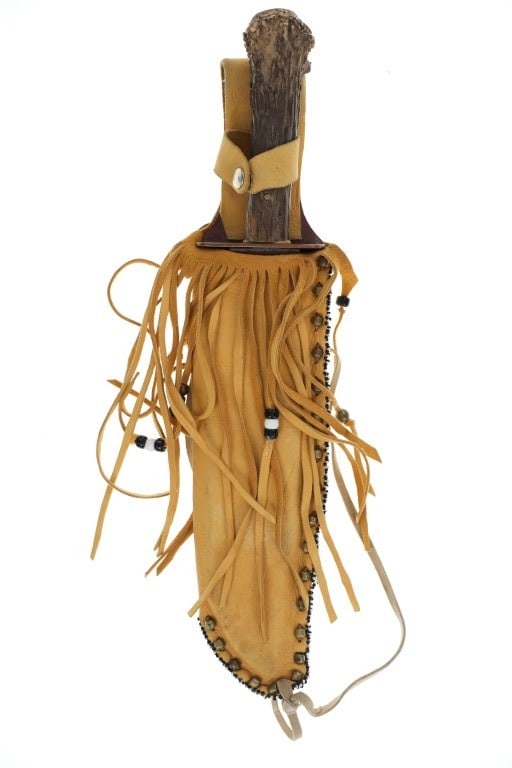 Ca. 20th Century Southern Plains Fighting Knife: Featured in this lot is this Southern Plains fighting knife circa 20th century. The fighting knife features a wonderfully and professionally crafted Indian tanned hide, harness leather and trade bead 