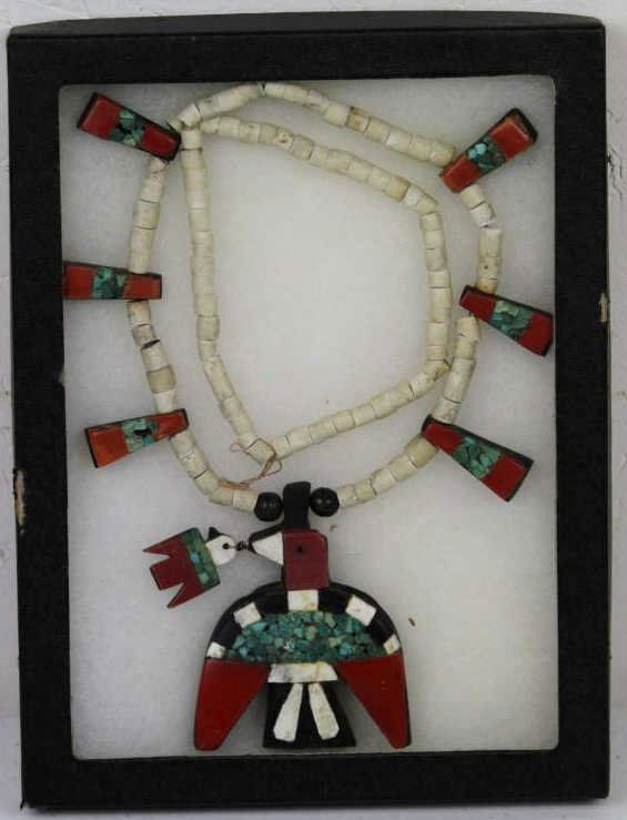 Zuni Indian Necklace circa 1920-30's: This is piece is from the Zuni people who have been recorded for 3,000-4,000 years. The necklace is hand crafted with Turquoise, Coral, Ebony, and more. It features a bird with 6 longer matching beads
