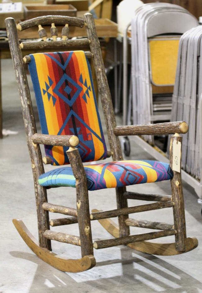 Hickory Primitive Rocker: This piece is made of Hickory with the bark and a Navajo style seat covering.