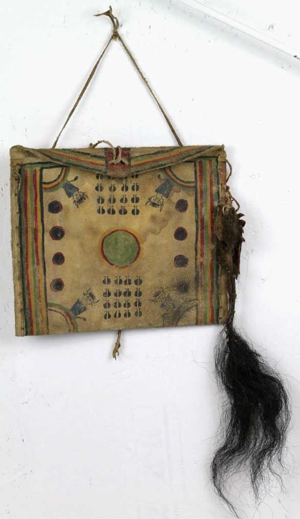 Cheyenne Parfleche Flat Case circa early 1900's: This is made of smoked brain tan Buffalo Rawhide and sewn with brain tan deer hide. There is a genuine buffalo rail and hide effigy attached. Has good patina and distress for age. The original of this