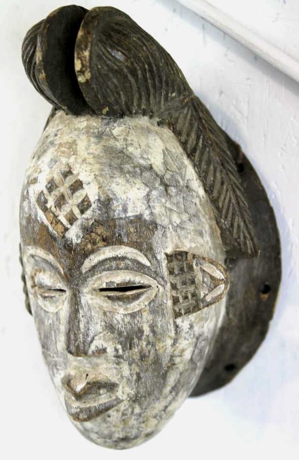 Gabon African 1800's Spirit Mask: This is a Spirit mask hand carved in the 1800's more than 130 years old. Incredible piece of African History. The mask is from either ancient tribes of Bantu or Orugnu. This piece measures 11.5-12" lo