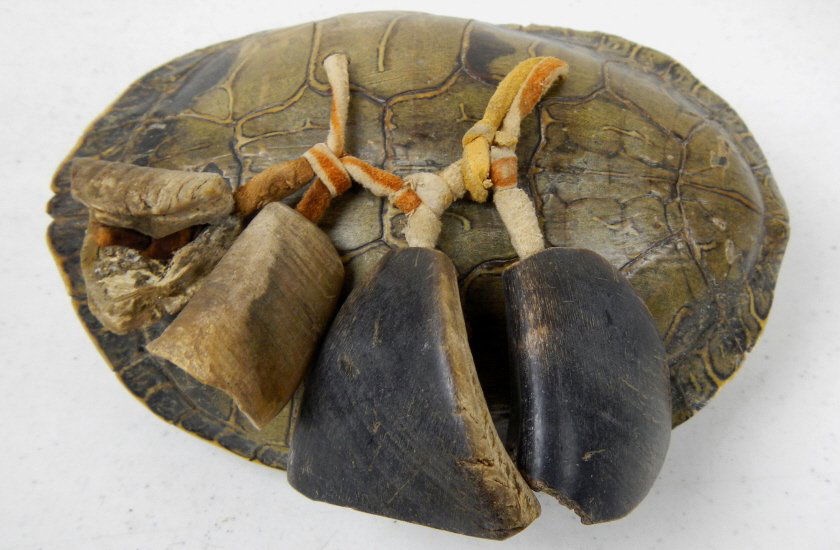 Pueblo Turtle and Dew Claw Rattle: This is made by the Pueblo Native Americans and features a turtle shell that measures 6.25-6.5" long, Elk Dew Claws, and Buffalo Dew Claws. In great condition.