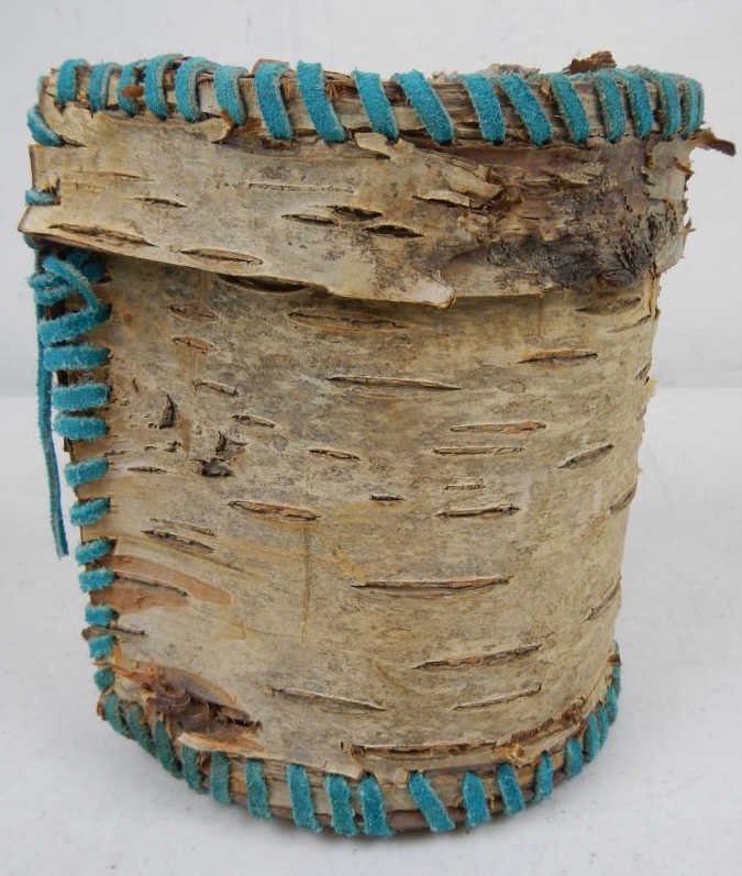 Birch Bark Basket: Measures 6" tall 6" in diameter. Made of Birch bark and Blue dyed Leather strips.