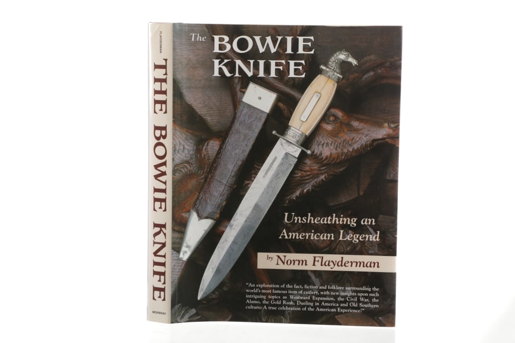 The Bowie Knife: Unsheathing an American Legend: Featured in this lot is a 2004 book called The Bowie Knife: Unsheathing an American Legend by Norm Flayderman. The book features a hand written and signed message from the author to Michael Poprocki.