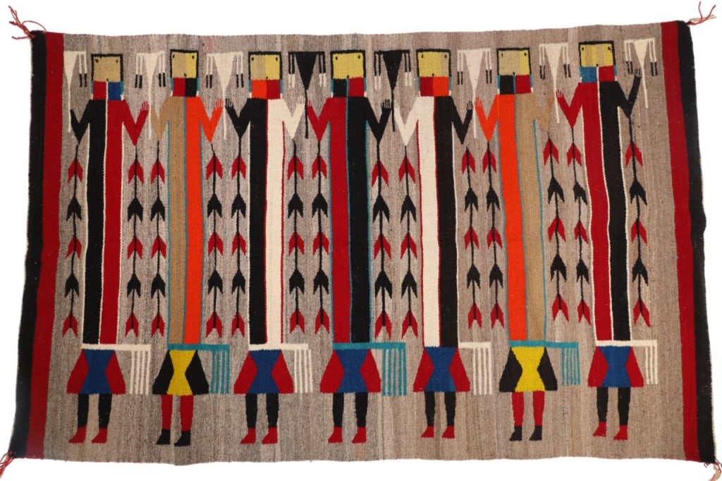 Ca. 1950-1960 Navajo Yei Lukachukai Large Rug: The lot features a Navajo Lukachukai Yei rug with fine weave, handspun wool and large size that dates to circa 1950-1960?s. This Lukachukai Yei / Yeibichai rug features seven Yei figures each holding