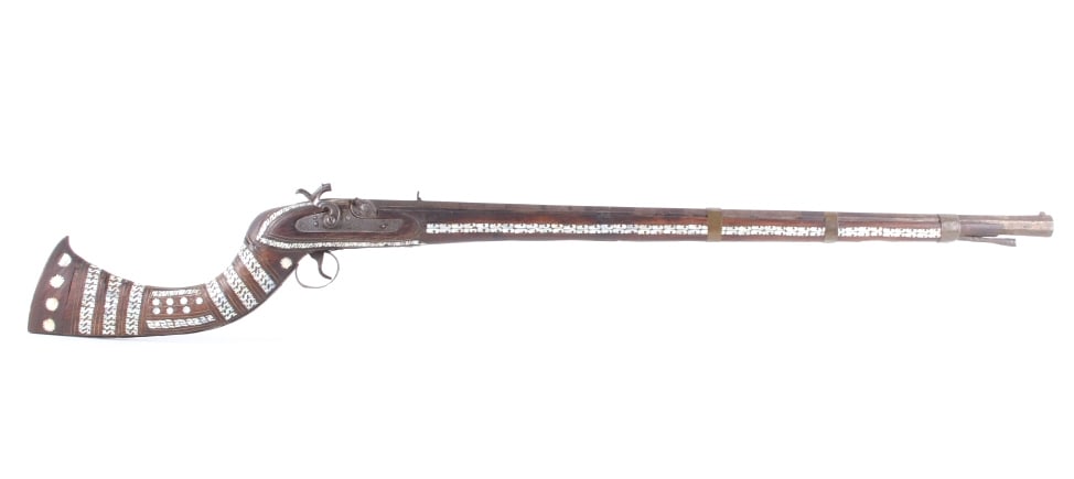 19th C. Afghan Pearl Inlayed Khyber Pass Rifle: Featured in this lot we have an Afghan Khyber Pass pearl inlayed percussion cap camel rifle.45 gauge. This model of rifle was manufactured by the tower of England armorers in the 1800's. The tower rif