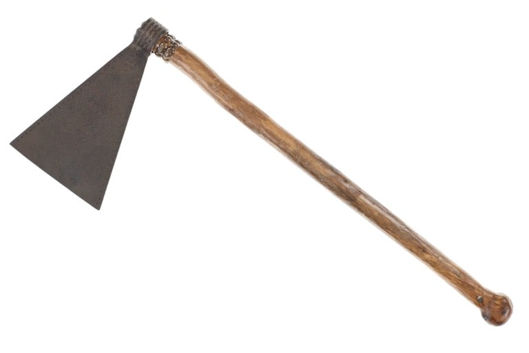 Missour War Axe Tomahawk w/ Punch Dot Engraving: The lot features a large head Missouri War Axe tomahawk with punch dot design and carved wood haft, attributed to the upper Missouri River basin. The head is forged iron metal with a large triangle ty
