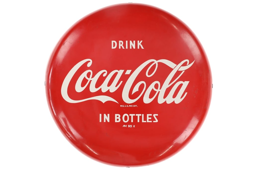 Ca. 1950's Drink Coca-Cola Button Metal Sign: Featured in this lot is this original, Coca-Cola "Drink Coca-Cola In Bottles" button sign from the 1950's. This metal sign shows a circular shape with a bright red color and white lettering reading, "