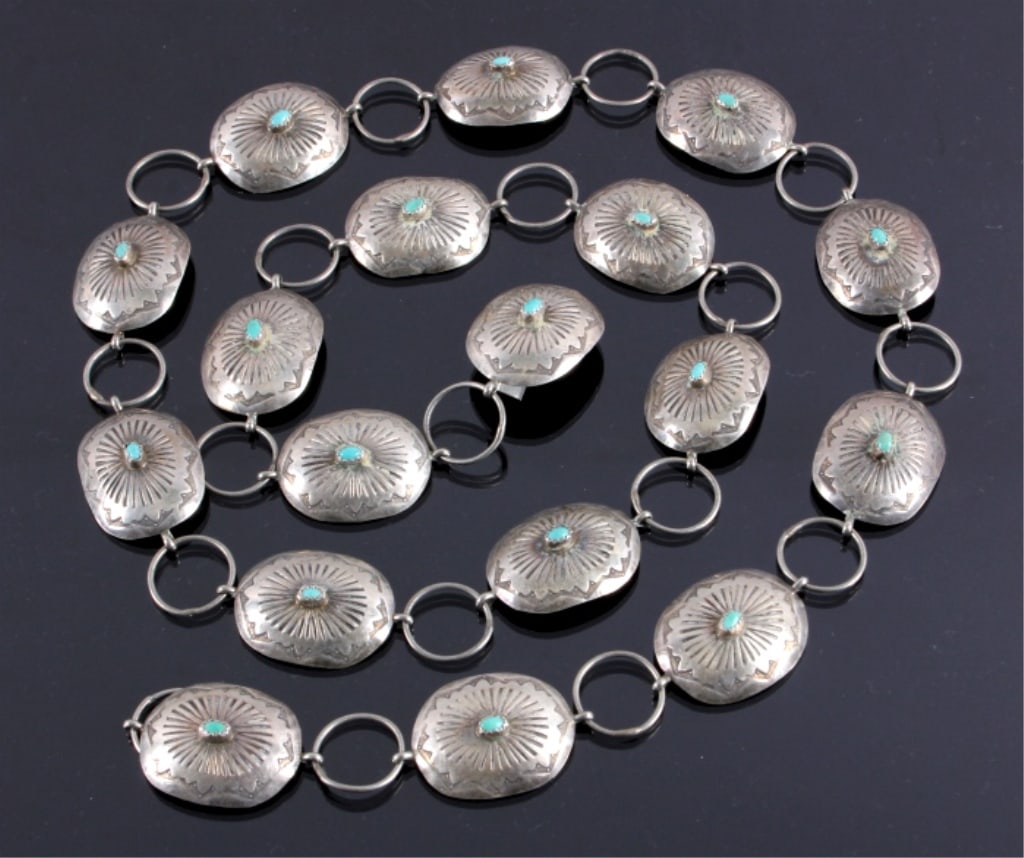 Vintage Pawn Navajo Concho Belt w/ Turquoise: The lot features an old vintage pawn sterling silver concho / concha belt dating to circa 1950-1970?s. The belt features seventeen concho / conchas with each having a classic Navajo stamping and set w