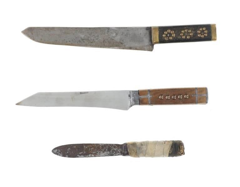 Antique Frontier Plains Tacked Inlaid Trade Knives: The lot features three antique trade knives from the Plains of the American Frontier. The first example shows pewter inlays in the handle and brass tacking designs on both sides with pewter end cap at