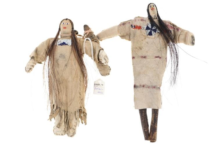 Late-19th C. Northern Plains Beaded Hide Dolls (2): The lot features a set of late 19th-century early 20th-century beaded Indian hide dolls from the Northern Plains and ex-Hindman auction. The set shows Indian tanned hide with trade thread sewing showi