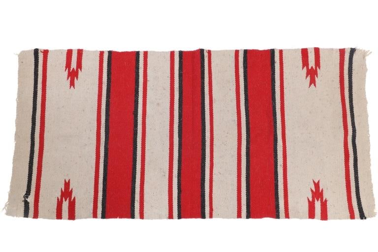 Vintage Mexican Wool Woven Saddle Blanket: The lot features a nice vintage woven wool saddle blanket from a Mexican weaver. The blanket shows a banded saddle blanket design with small half diamond stepped patterns in classic Saltillo style des