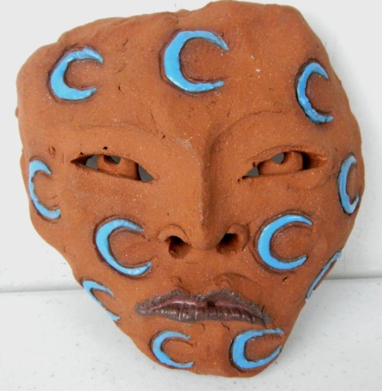 "Quiet Evening" by LaFontaine: This is all hand made original pottery art by famous artist Glen LaFontaine. This piece is signed and dated, "7-2005." This piece features a Native American Mask with Crescent moons. In good condition