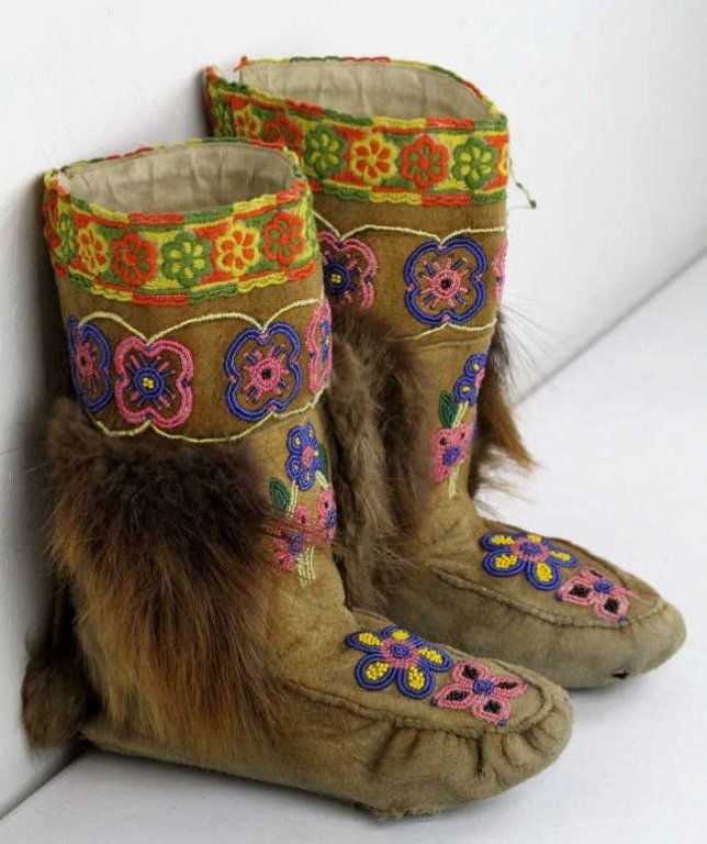 Northwest Coast Indians Boots: These are a very well hand made pair of Boots made by the Northwest Coast Native Americans. These feature hand done beadwork in great condition with a floral design, each boot has beaver fur on both s