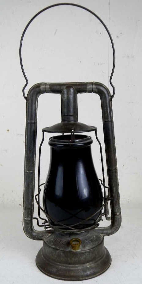 Dietz Monarch Lantern: This is an old Dietz Monarch Lantern with a original thicker glass red globe. This piece measures 13.5" tall with an 5 1/8" tall handle and is 6" in diameter.