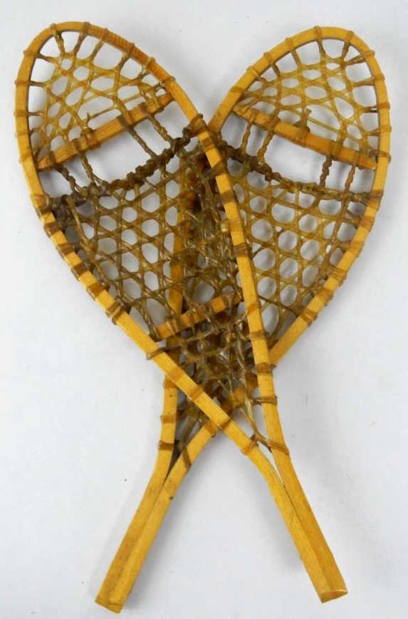 Decor Rawhide Snowshoes: These are Made in Canada and feature a wood frame with stretched rawhide. These are smaller and make a great decor item. These are well made and even feature the front curved forward. Measures 15.5" l