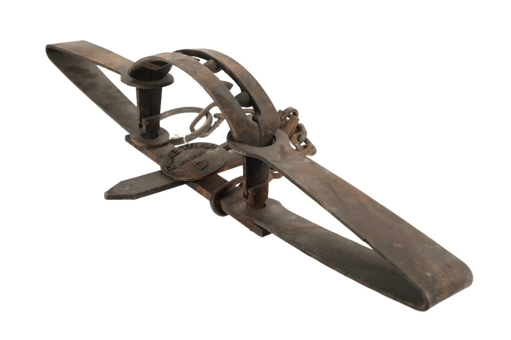 Duke Trap #15 Bear D Double Spring Bear Trap: Featured in this lot is a Duke Trap No. 15, Bear D double spring bear trap. The trap features a professionally crafted steel construction that shows six staggered teeth adorning the trap and reads as