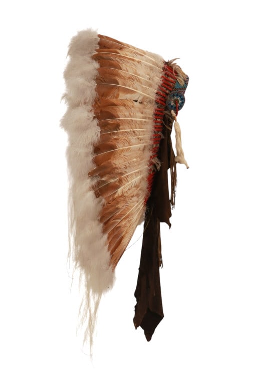 Lakota Sioux John Young Buck Feather Headdress: This is an original John Young Buck of the Lakota Sioux Native American Indians feathered headdress with large size and beautiful beadwork and quillwork. The piece was handmade by full blood Lakota Si