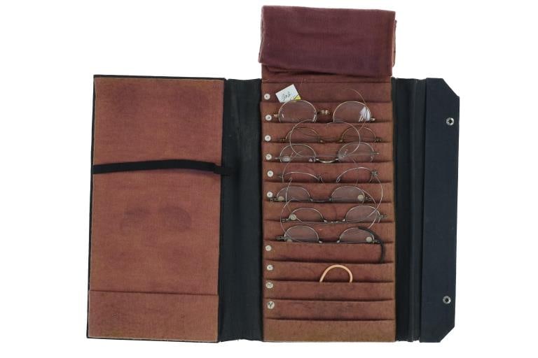 Eye Glasses & Case From Tombstone, A.T. 1890-1900s: Featured in this lot is this glasses case filled with seven pairs of early eye glasses from Tombstone, Arizona Territory 1890s - 1900s. A few of the glasses are marked on the nose bridge and come from