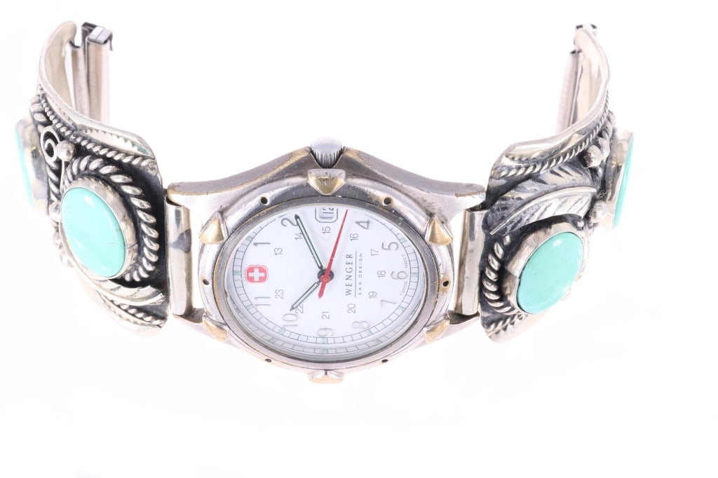 Mexican Sterling Silver Fox Turquoise Watch Band: Featured in this lot is this Mexican sterling silver Fox turquoise watch band and Wenger watch circa 1970's. The watch band features a wonderfully and professionally crafted sterling silver for the wa
