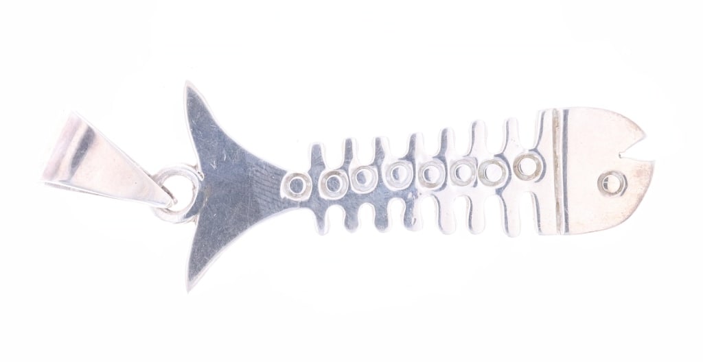 Taxco, Mexico Sterling Silver "Bone Fish" Pendant: Featured in this lot is this Taxco, Mexico sterling silver "Bone Fish" pendant circa 1970's. The pendant features a wonderfully and professionally crafted sterling silver construction that shows the d