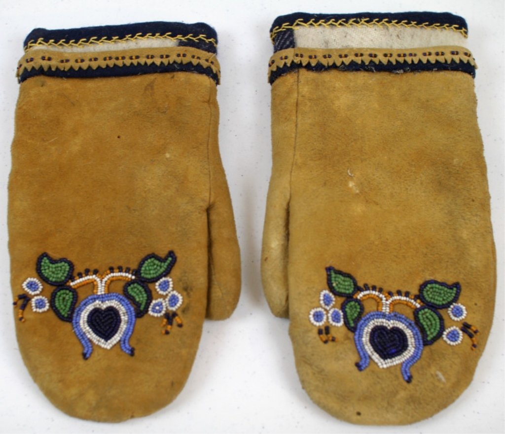 Crow Gloves: These are tight bead worked hand made by the Crow Native Americans. These are lined with wool and are from the 1950-1970's. Measures 10" long.