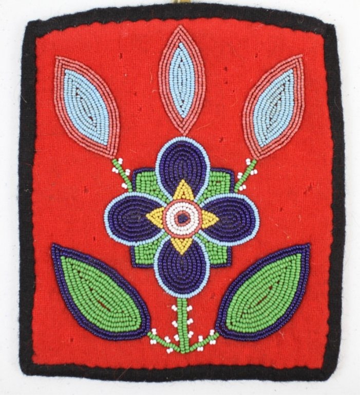 Nez Perce Beaded Flat Bag: This piece features a floral design bead work on both sides which is rare to find by the Nez Perce. This is hand made and in great condition. This is lined with old trade felt and is from the 1940-50'