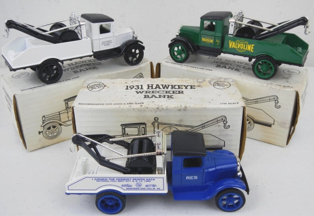 1931 Hawkeye Wrecker Banks: This lot includes 3 banks with the keys. These are made by the Ertl Comp Inc. This lot includes New Jersey State Police Patrol 75th Anniversary, Hersey Auto Club 'RES', Valvoline Oil Company. These we