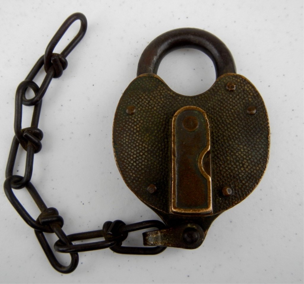 Antique Yale Padlock: Old padlock with chain made of solid Brass by the Yale Company. No Key, but is a skeleton key-type. Measures 4.25" with a 8"chain.
