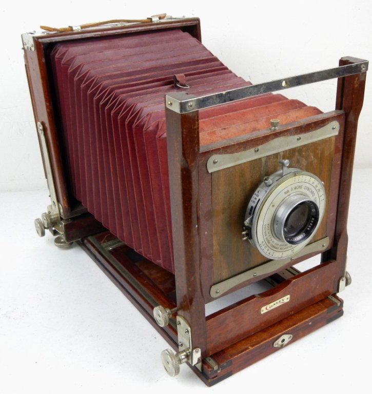 Conley Kodiak Bellow Camera: This is a very early Camera from early 1900's made by Conley with a Kodiak Lens on the front. This piece takes glass plates that are 7"x5" The camera is a box camera with bellows that stretch. This ca