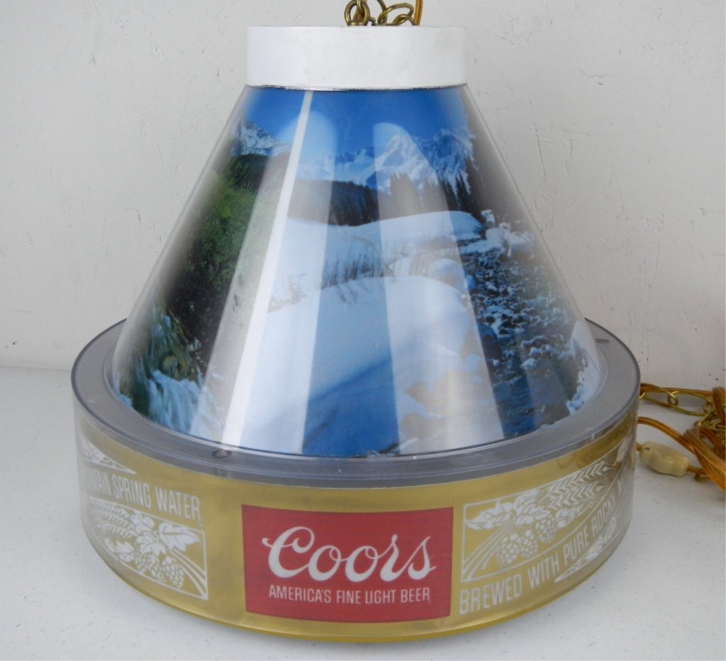 Coors Beer Lamp: This is a working hanging light or lamp made by Coors. This features 3 Rocky Mountain wilderness scenes and says, "Brewed with Pure Rocky Mountain Spring Water." Great Beer advertisement collectible.
