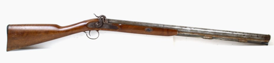 Thompson New Englander 12 Ga Black Powder Shotgun: This is a Black Powder Gun made by Thompson Center Arms and is the New Englander Model 12 Ga Shotgun. This gun is modeled after the Antique Style, but is a more modern gun. This gun makes a great deco