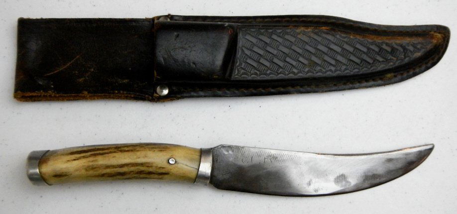 Custom Antler Knife and USA Leather Scabbard: This lot features a well made custom knife that is very sharp and features a great antler handle. This lot also features a hand made leather scabbard that is marked, "MX3 Maxam Top Grain Leather Made